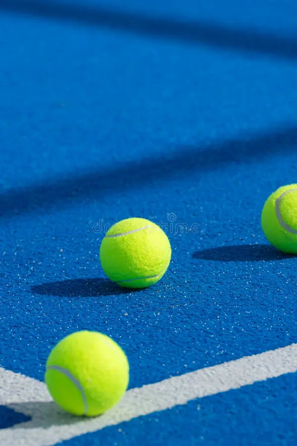 files/minimalist-sports-background-padel-balls-white-line-three-yellow-tennis-balls-blue-padel-court-concept-sport-403935961.webp